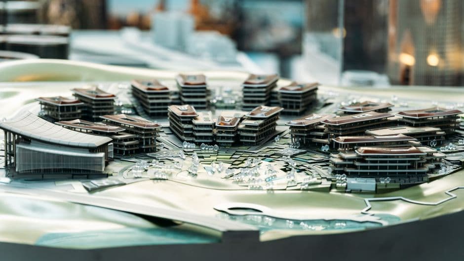 Detailed architectural model showcasing modern urban development with multiple buildings.