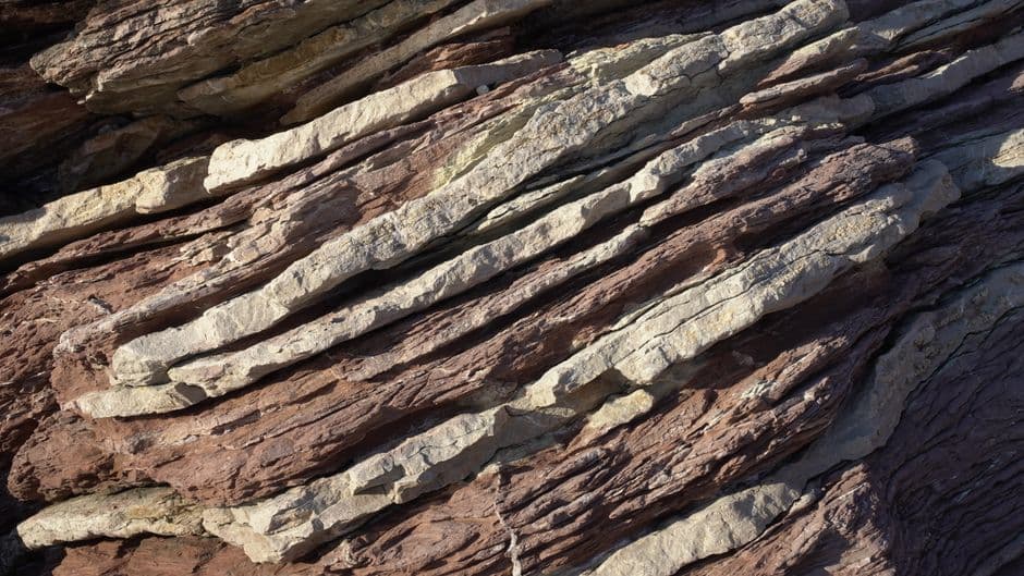 Detailed view of layered rock formations showing natural geological patterns and textures.