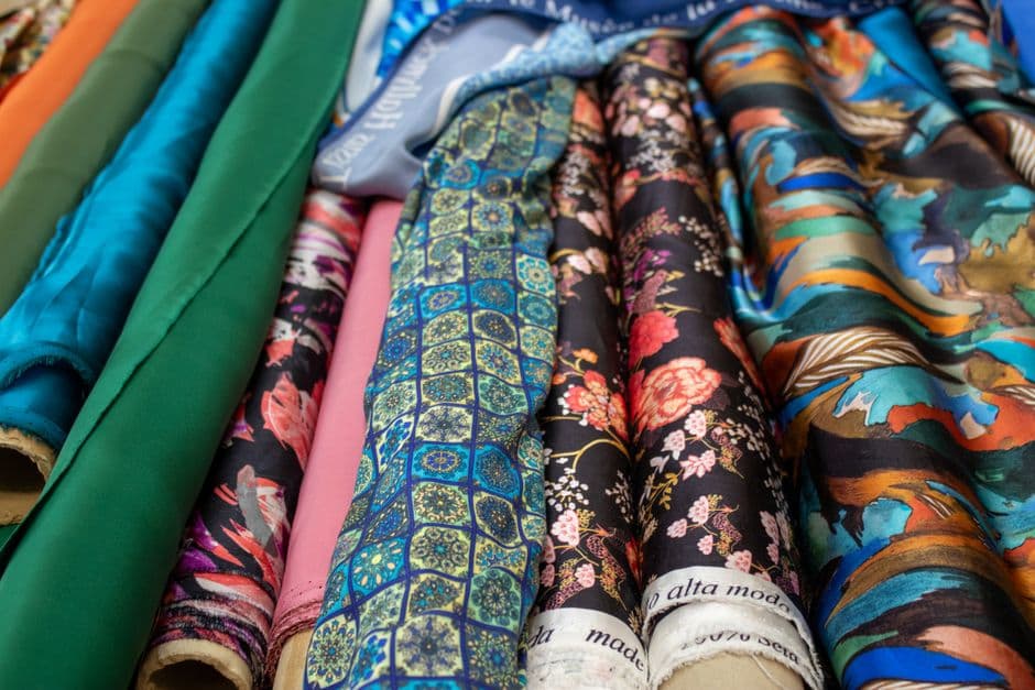 Vibrant selection of patterned fabric rolls showcasing diverse textile designs.