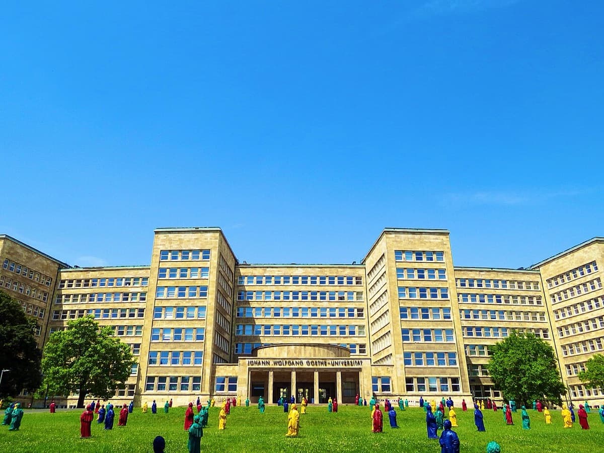 Johann Wolfgang Goethe University main building with distinctive yellow-gold facades in wide landscape format.