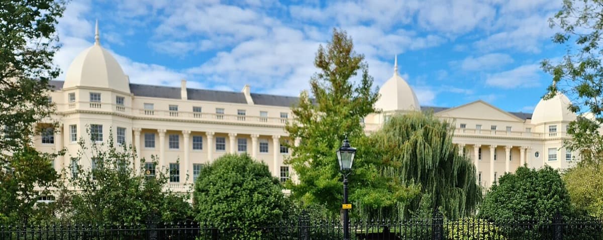 White classical building with distinctive domed roof of the Ratcliffe Building at London Business School, showing elegant institutional architecture.