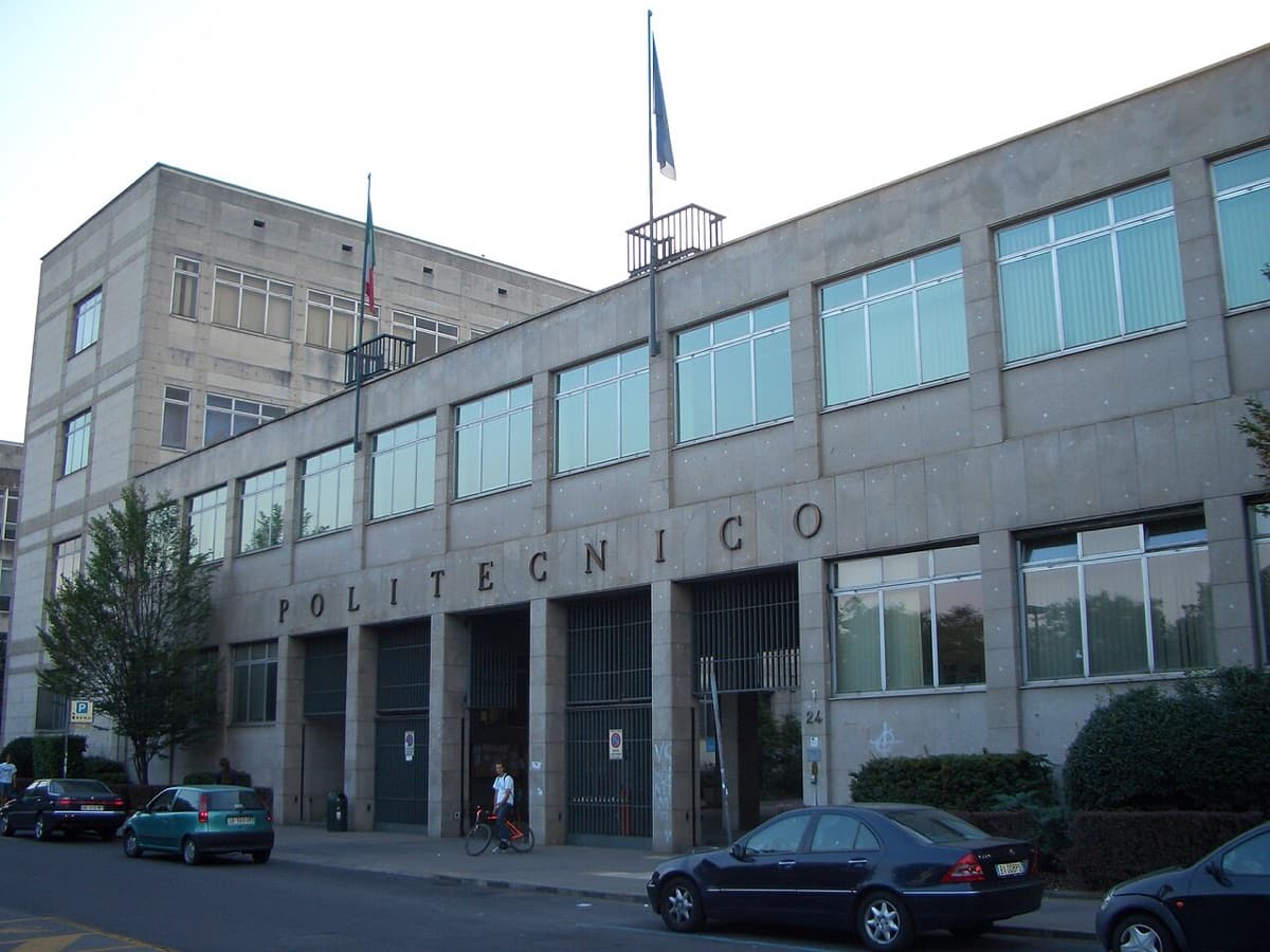 Campus building exterior of Politecnico di Torino with POLITECNICO signage visible on the facade in daylight.