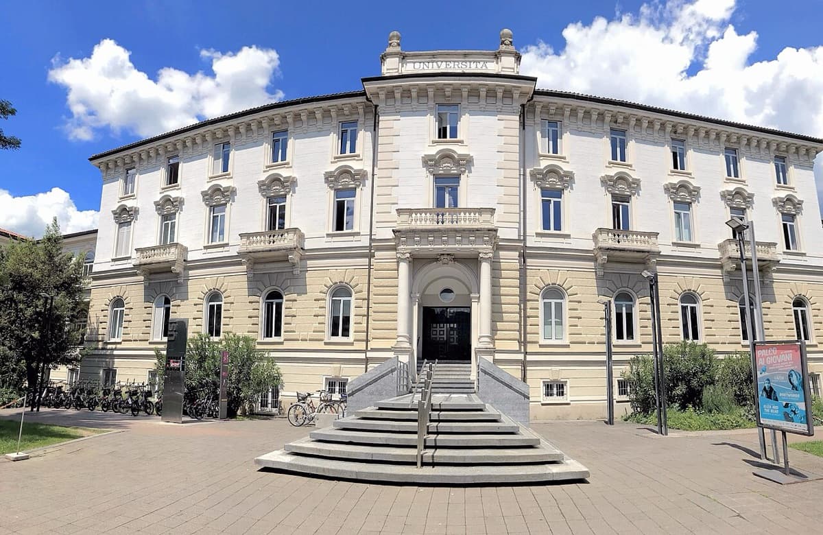 USI Università della Svizzera italiana main building in Lugano with blue sky and institutional architecture.