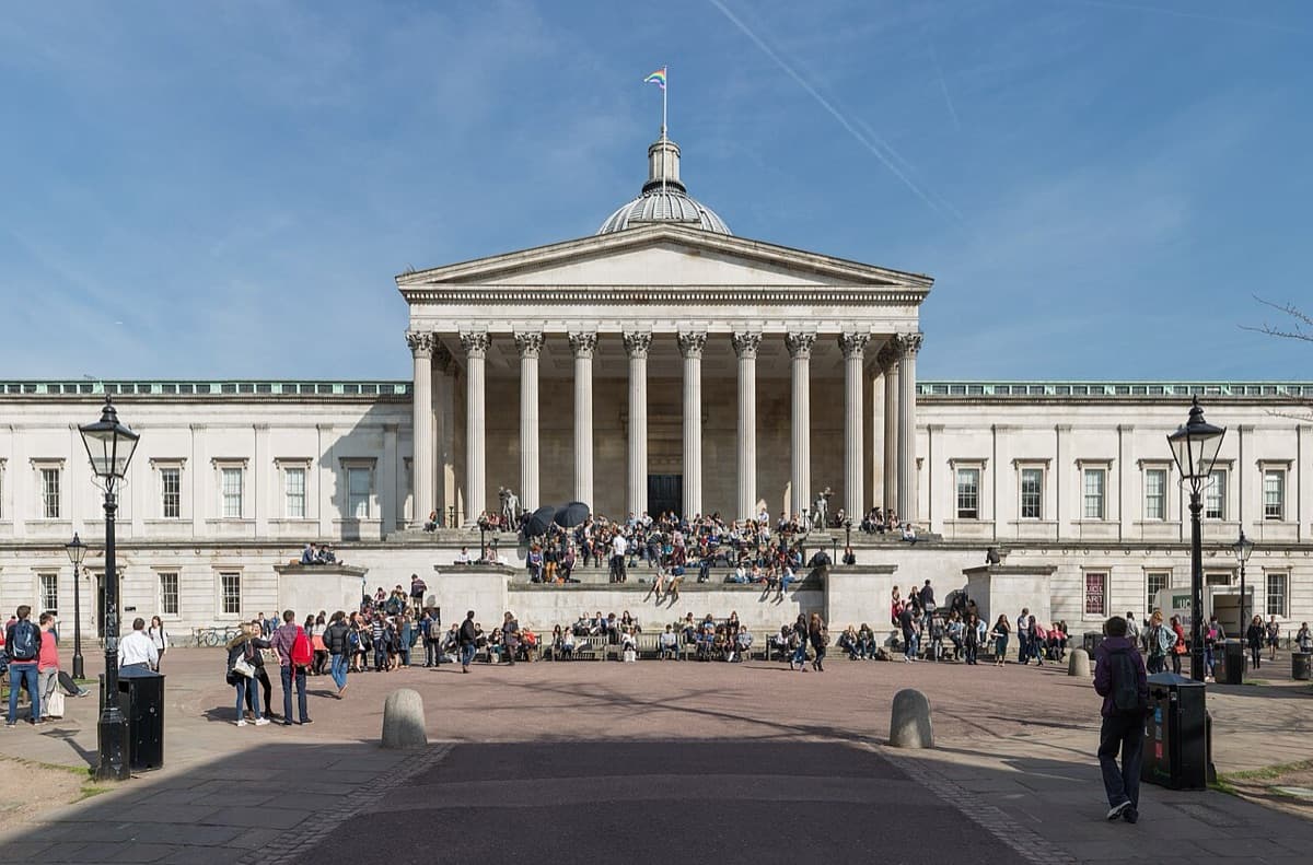 Iconic Wilkins Building at University College London with classical Greek Revival architecture, white stone columns, and domed entrance on Gower Street.