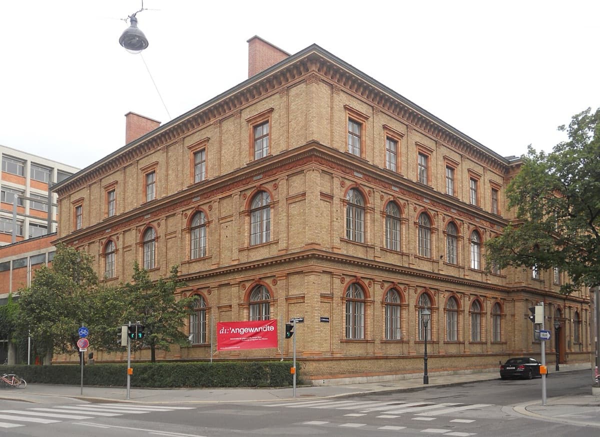 Historic Renaissance-style brick building of University of Applied Arts Vienna with ornate architectural details and symmetrical facade.