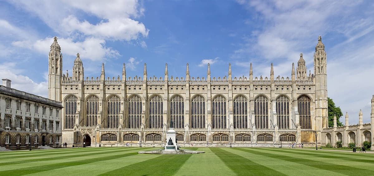 King's College Chapel at Cambridge University viewed from the front court, showing Gothic revival architecture and manicured lawns.