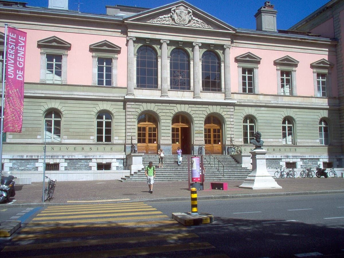 University of Geneva main building exterior with pink banner and classical institutional architecture.