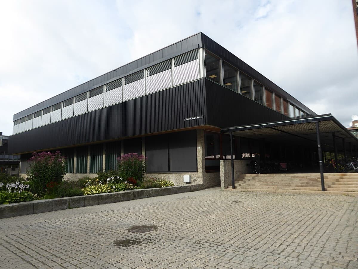 Modern black and glass building of University of Oslo with contemporary institutional architecture and clear lines.