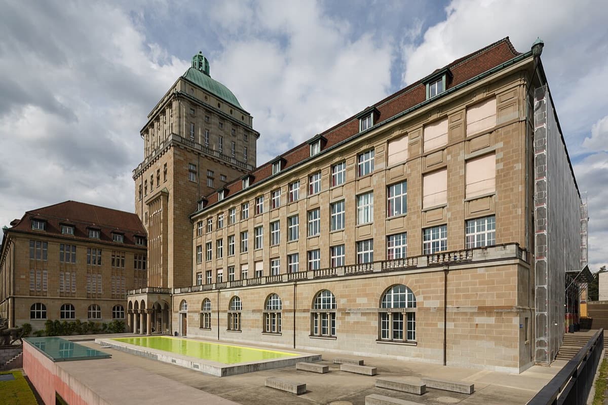 University of Zurich main building with classical architecture, columns, and campus courtyard.