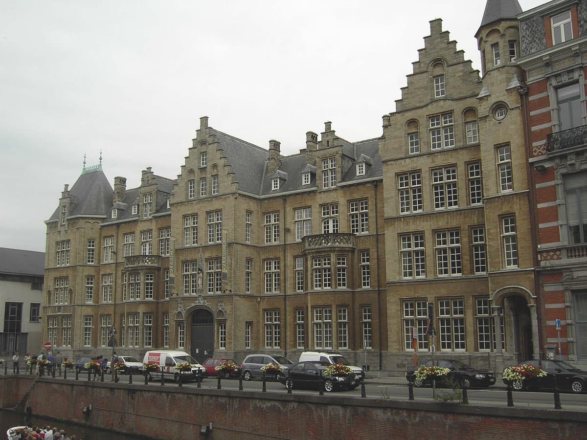 Vlerick Business School main building in Ghent, Belgium, with historic architecture and green courtyard.